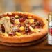 Domino’s oferece Amstel em dobro em ação especial de abril